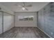 The bedroom offers light-colored wood-look floors and a large window for ample natural light at 2441 Persian Dr # 61, Clearwater, FL 33763