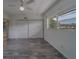 Bedroom with light-colored wood-look floors, large window, and closet at 2441 Persian Dr # 61, Clearwater, FL 33763