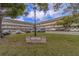 Building exterior shows well-kept landscaping and plenty of parking for residents and visitors at 2441 Persian Dr # 61, Clearwater, FL 33763