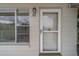 Inviting front door with gold hardware and sidelight window provides natural light at 2441 Persian Dr # 61, Clearwater, FL 33763