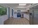 Modern kitchen with granite countertops and stainless steel appliances at 2441 Persian Dr # 61, Clearwater, FL 33763