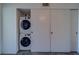 Laundry area features modern washer and dryer units with storage space at 2441 Persian Dr # 61, Clearwater, FL 33763