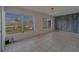 Bright living room with tiled floor and a view to outdoors at 2441 Persian Dr # 61, Clearwater, FL 33763