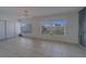 Bright living room with tiled floor and view to outdoors at 2441 Persian Dr # 61, Clearwater, FL 33763