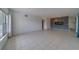 Open floor plan showcasing tile flooring and ample natural light from the large window at 2441 Persian Dr # 61, Clearwater, FL 33763