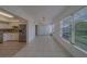 Bright living room with kitchen access and natural lighting at 2441 Persian Dr # 61, Clearwater, FL 33763