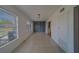 Bright, open living room with tile floors and natural light from large windows at 2441 Persian Dr # 61, Clearwater, FL 33763