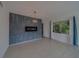 Bright living room features tiled floor, modern fireplace, and ample natural light at 2441 Persian Dr # 61, Clearwater, FL 33763