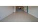 Spacious living room with tile floors and modern accent wall with fireplace feature at 2441 Persian Dr # 61, Clearwater, FL 33763