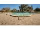 Inviting community pool features a spacious brick deck and mature trees providing shade at 2441 Persian Dr # 61, Clearwater, FL 33763