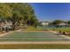 Enjoy outdoor activities with a well-maintained shuffleboard court surrounded by mature trees and open space at 2441 Persian Dr # 61, Clearwater, FL 33763