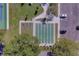 View of shuffleboard court with benches, surrounded by green space and parking at 2441 Persian Dr # 61, Clearwater, FL 33763