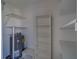 Functional storage room with shelving and a water heater at 2441 Persian Dr # 61, Clearwater, FL 33763