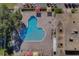 Enjoy a refreshing dip in the uniquely shaped community pool with ample seating and shaded areas at 2441 Persian Dr # 61, Clearwater, FL 33763