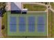 Overhead shot of the four tennis courts shows court markings and viewing shelter at 2441 Persian Dr # 61, Clearwater, FL 33763