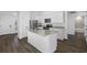 Bright kitchen with granite countertops, stainless steel appliances, and a central island at 2464 Fairview Ln, Spring Hill, FL 34609