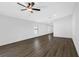 Spacious living room featuring wood-look floors, recessed lighting, and neutral paint scheme at 2464 Fairview Ln, Spring Hill, FL 34609