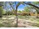 Large backyard with mature trees provide privacy and shade at 2503 Victarra Cir, Lutz, FL 33559