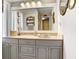 Bathroom featuring a marble vanity, modern mirrors and decor, and tiled floors at 2503 Victarra Cir, Lutz, FL 33559