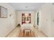 Formal dining room with elegant chandelier, china cabinet, and large window at 2503 Victarra Cir, Lutz, FL 33559