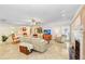 Comfortable living room with tile floors, neutral paint, fireplace and lots of natural light at 2503 Victarra Cir, Lutz, FL 33559