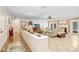 Open-concept living room with tile floors, a fireplace, and access to backyard patio at 2503 Victarra Cir, Lutz, FL 33559
