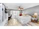 Spacious bedroom with ceiling fan, natural light, and a cozy ambiance at 2503 Victarra Cir, Lutz, FL 33559