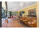 Covered patio features brick flooring, bar seating, dining area and ceiling fans at 2503 Victarra Cir, Lutz, FL 33559