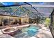 Pool with spa is the focal point of this outdoor space at 2503 Victarra Cir, Lutz, FL 33559