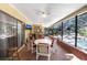A screened patio overlooking a pool area with lots of seating and entertaining space at 2503 Victarra Cir, Lutz, FL 33559