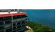 Condominium building with multiple balconies overlooking bay views and lush greenery for outdoor enjoyment at 2700 Bayshore Blvd # 11405, Dunedin, FL 34698
