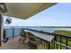 Spacious balcony with four chairs and water views at 2700 Bayshore Blvd # 11405, Dunedin, FL 34698