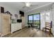 Bedroom with hardwood floors, ceiling fan, balcony access and lots of natural light at 2700 Bayshore Blvd # 11405, Dunedin, FL 34698