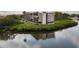 Waterfront condo complex with lush landscaping and tranquil water views at 2700 Bayshore Blvd # 11405, Dunedin, FL 34698