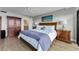 Bedroom with scenic picture and adjacent bathroom at 2700 Bayshore Blvd # 11405, Dunedin, FL 34698