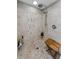 Shower with marble and tile work, and a built in seat at 2700 Bayshore Blvd # 11405, Dunedin, FL 34698