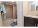 Cozy bathroom featuring a shower with tub, tiled walls, and a modern vanity at 2725 11Th Ct, Palm Harbor, FL 34684