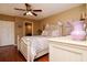 Inviting bedroom with light walls and wood floor features, complemented by matching furnishings at 2725 11Th Ct, Palm Harbor, FL 34684