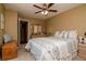 This light-filled bedroom has a ceiling fan and is decorated with light walls and carpet at 2725 11Th Ct, Palm Harbor, FL 34684
