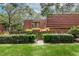 Charming townhome with a red tile roof, privacy fence, and mature landscaping at 2725 11Th Ct, Palm Harbor, FL 34684