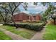 Charming townhome with a red tile roof, privacy fence, and mature landscaping at 2725 11Th Ct, Palm Harbor, FL 34684