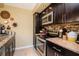 Updated kitchen with granite counters, stainless steel appliances, and ample storage at 2725 11Th Ct, Palm Harbor, FL 34684