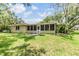 Backyard with screened-in porch, perfect for outdoor living and entertaining at 2911 Pemberton Creek Dr, Seffner, FL 33584