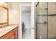Bathroom featuring glass enclosed shower and a granite countertop vanity at 2911 Pemberton Creek Dr, Seffner, FL 33584