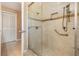 Bright bathroom with a glass-enclosed shower with tiled walls and a convenient grab bar at 2911 Pemberton Creek Dr, Seffner, FL 33584