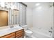 Cozy bathroom featuring a combo tub and shower and a vanity at 2911 Pemberton Creek Dr, Seffner, FL 33584