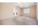 Spacious bedroom with carpet, a ceiling fan, and an ensuite bathroom at 2911 Pemberton Creek Dr, Seffner, FL 33584