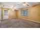 Bedroom with neutral carpet, ceiling fans, and a window at 2911 Pemberton Creek Dr, Seffner, FL 33584