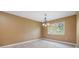 Dining room featuring wood flooring, a chandelier, and a window at 2911 Pemberton Creek Dr, Seffner, FL 33584