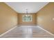 Dining room featuring wood flooring, a chandelier, and a window at 2911 Pemberton Creek Dr, Seffner, FL 33584